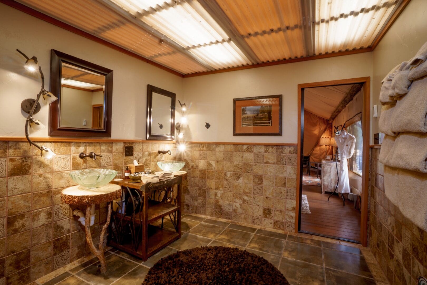 Inside of a fancy western themed bathroom.